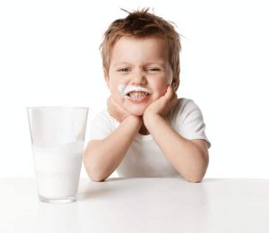 Child with milk moustache
