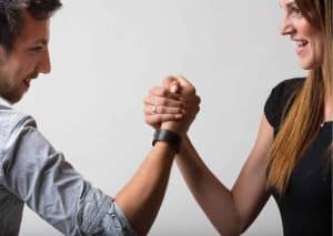 Arm wrestle between a man and a woman